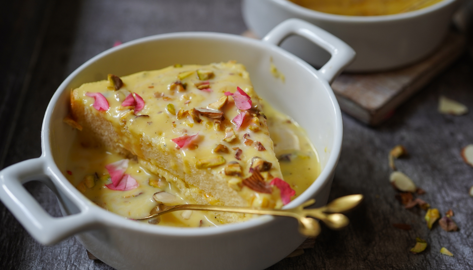 Velvety cottage cheese patties soaked in chilled saffron milk, finished with a sprinkle of pistachios.